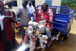 Woman riding a motocycle taxi