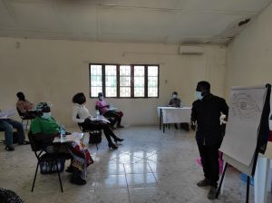 Classroom with the assistants attending to the teacher