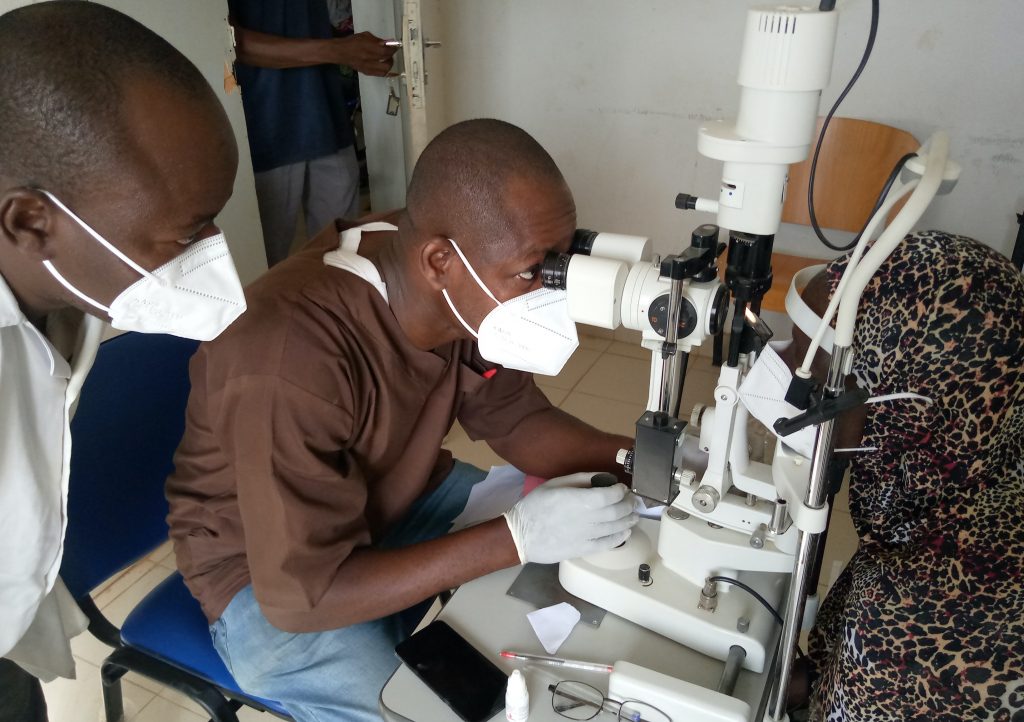 Ophthalmologist checking a woman's eyesight Ophthalmologist checking a woman's eyesight