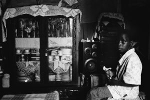 Child listening to the radio. Photo by Elisenda Pons/Inhambane