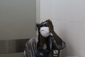 A woman covering one eye