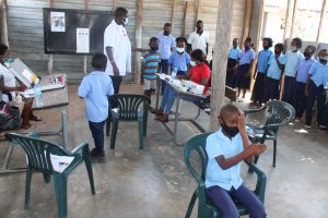 Children in the classroom during the eye check-up.