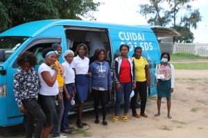 Group of women in front of the mobile optics van.