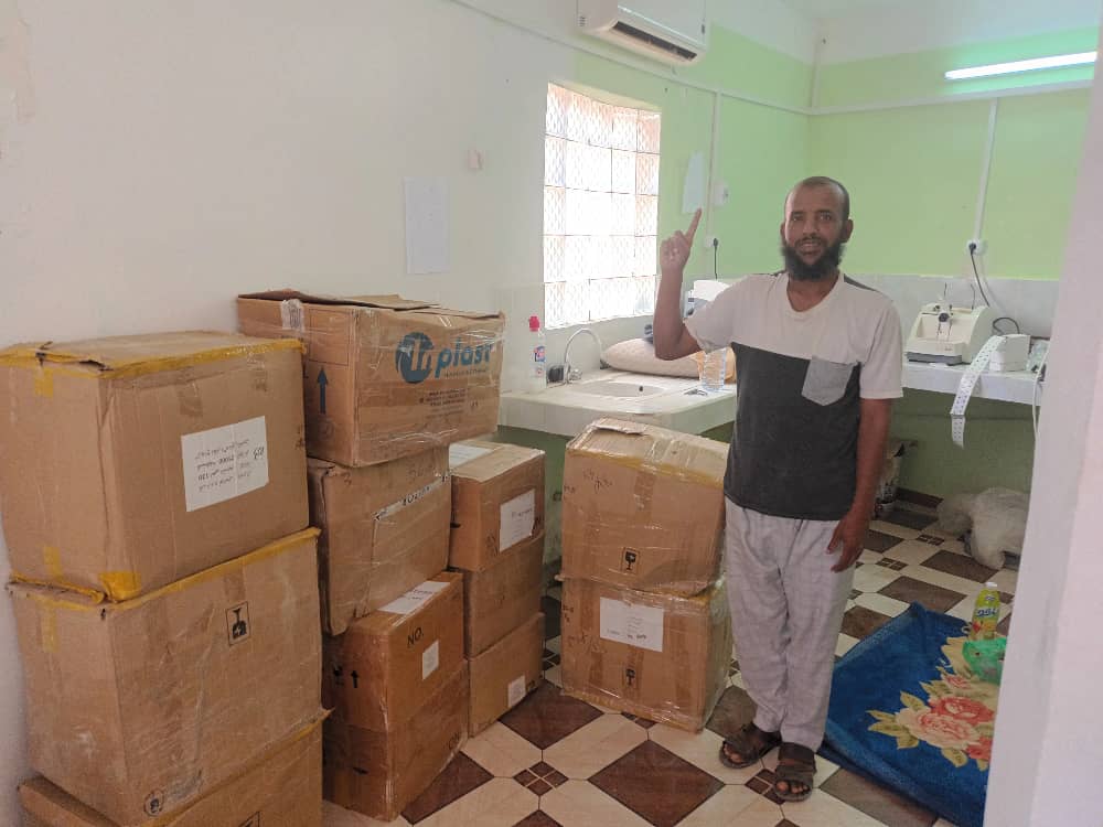 A man with the boxes containing lenses A man with the boxes containing lenses