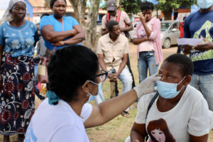 Eye examination of a woman in Inhambane