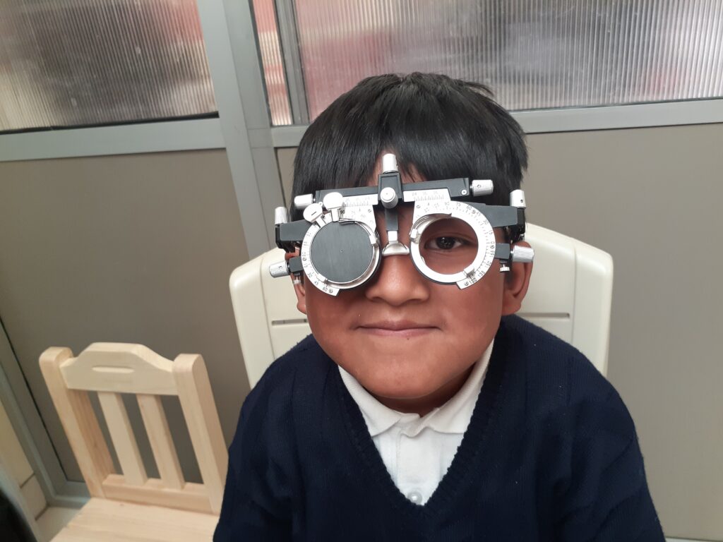 Child taking a visual acuity test. Child taking a visual acuity test.