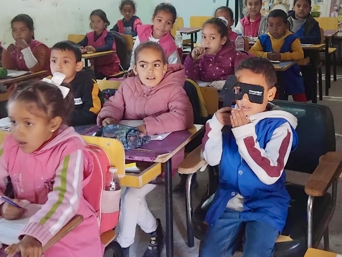 Sahrawi children being examined in a classroom